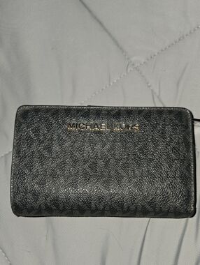 Michael Kors Jet Set Travel wallet in a black signature logo print